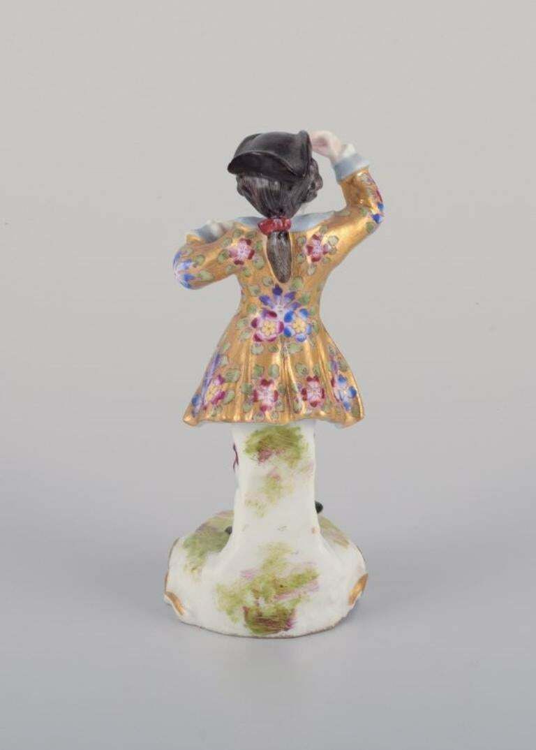 Meissen, Germany. Porcelain Figurine Of Young Man In Elegant Attire. photo Home Decor