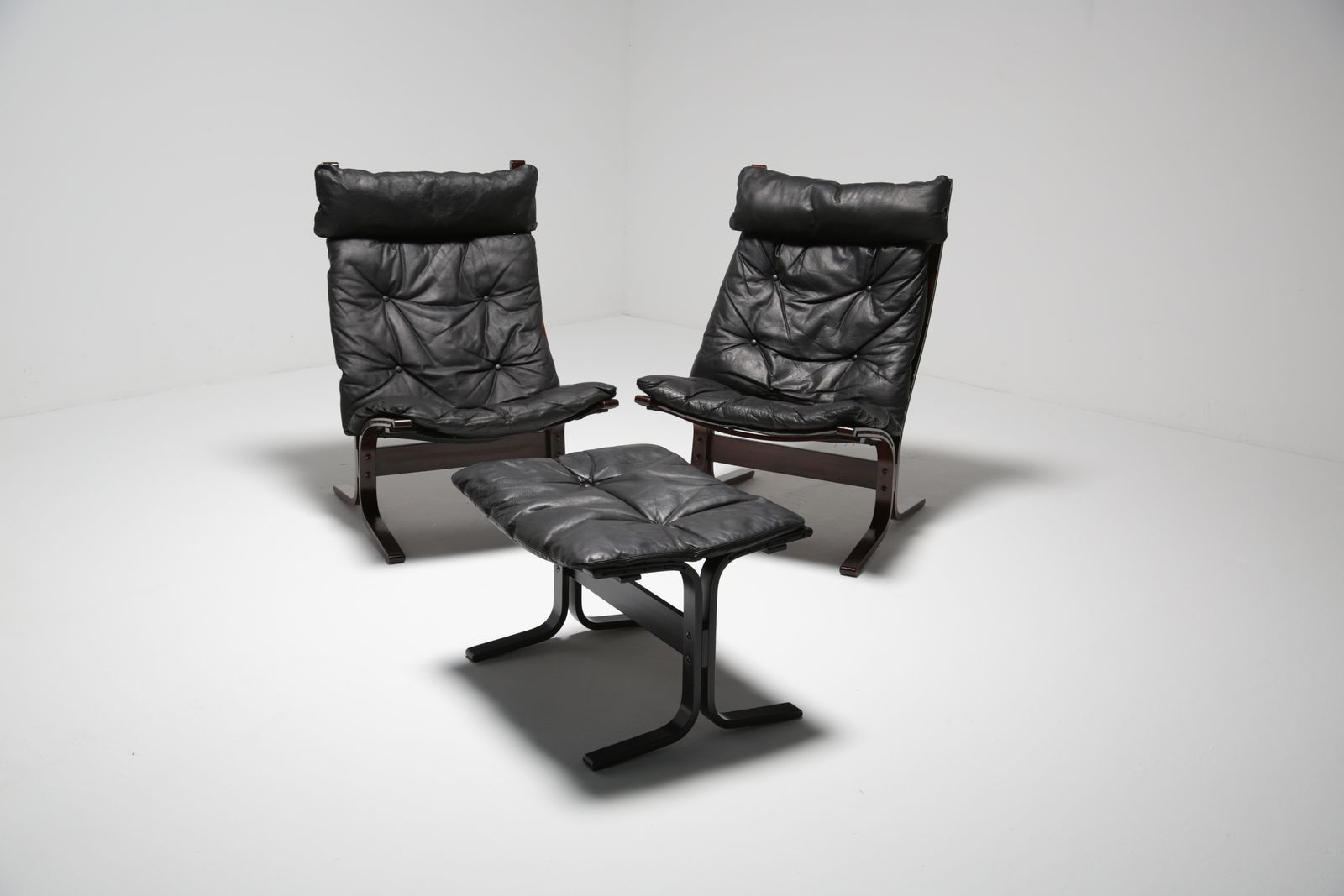 Pair Of Black Leather Lounge Chairs And Footstool “Siesta” By Ingmar Relling For Westnofa, Norway, 1960s.