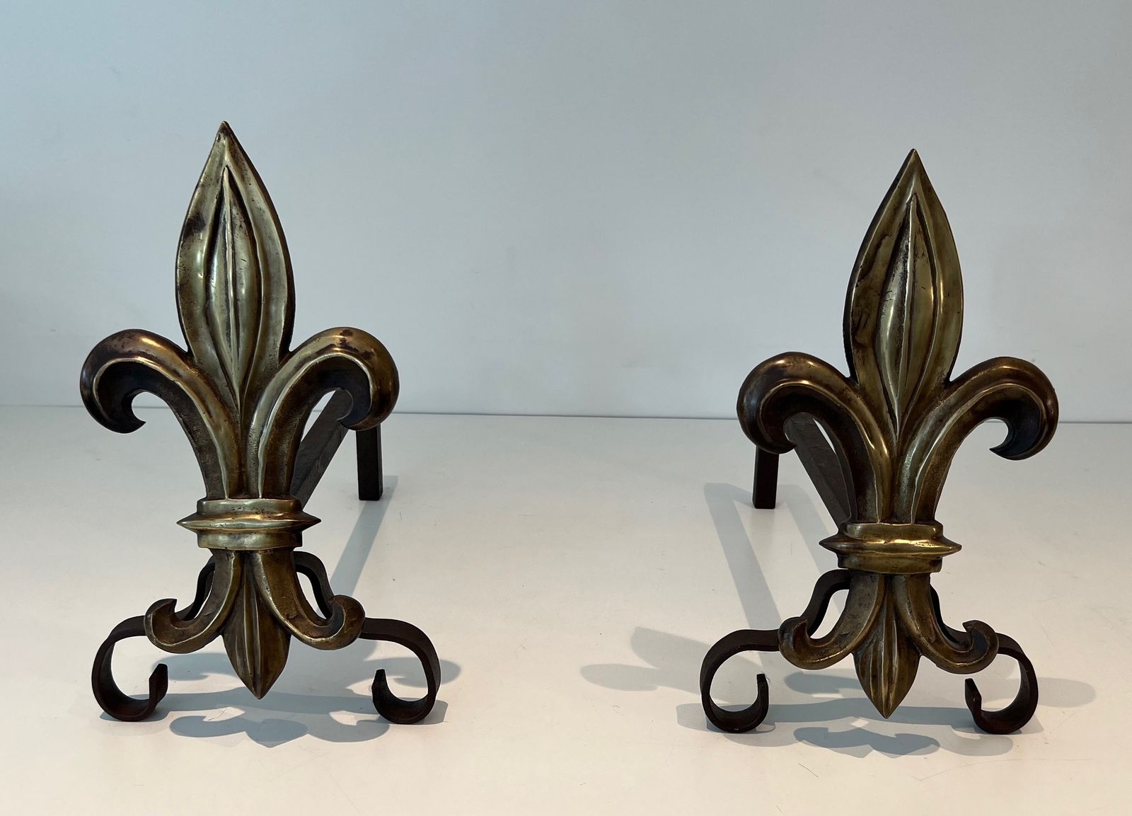 Pair Of Bronze And Wrought Iron Andirons Representing A Fleurs De Lys photo furniture