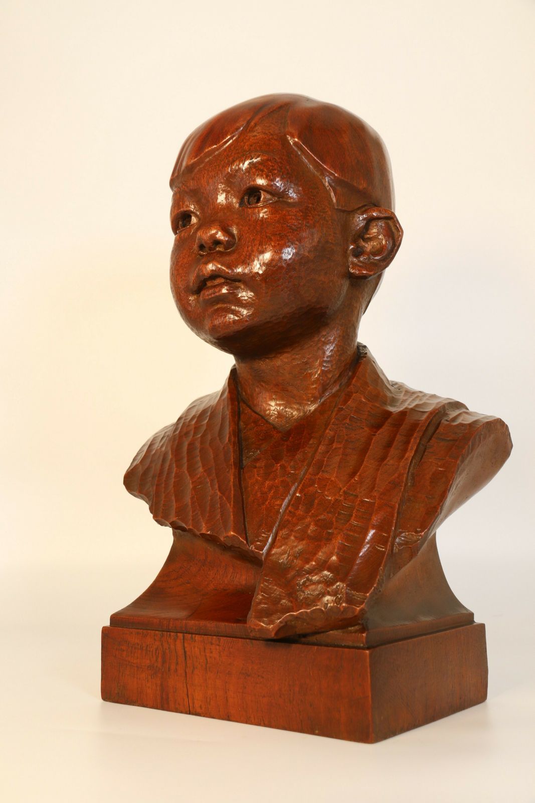 photo buy A Fine Carved Life Size Walnut Sculpture Bust Of An Oriental Boy By George Henry Paulin, Scottish (1888 – 1962)