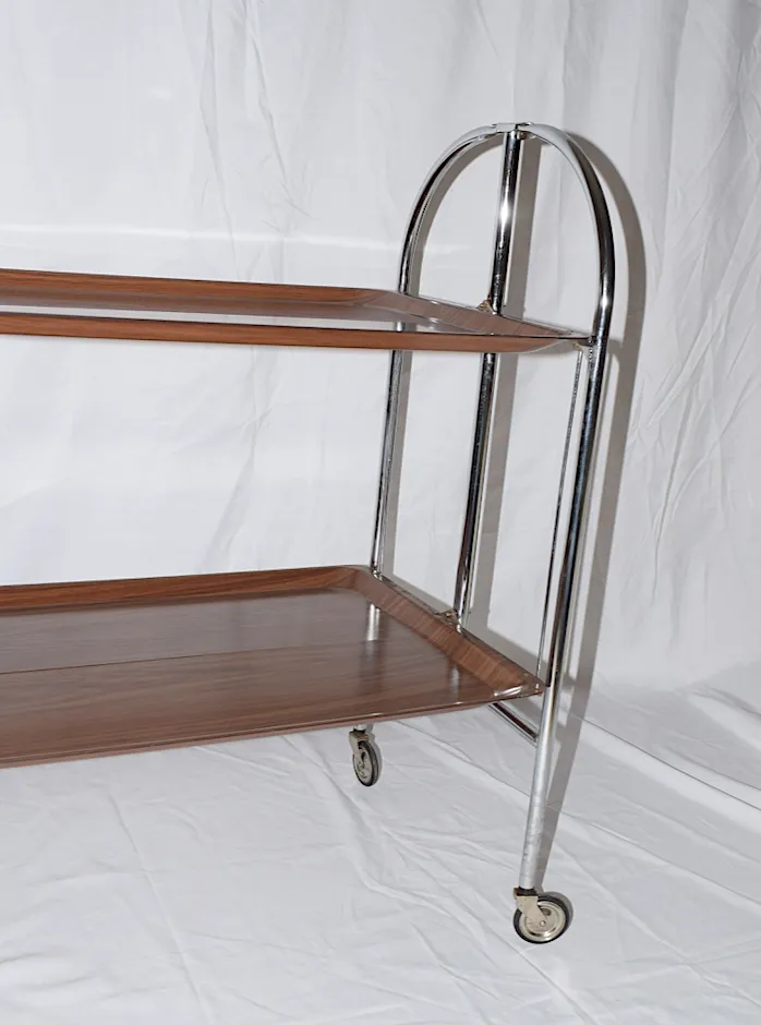 A Mid Century Bremshey & Co German Dinette Trolley. Made Of Chrome & Lamented Wood. It Folds Into A Smaller Frame. Attribution Mark On The Wheels. photo Furniture