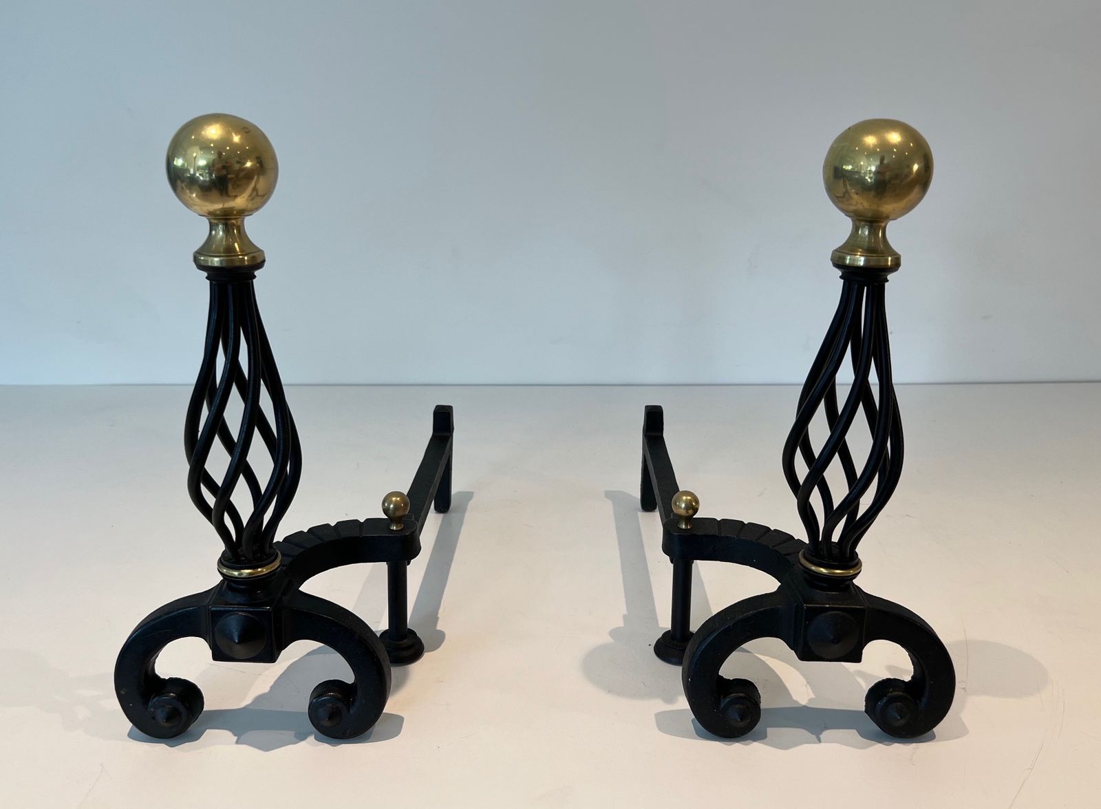 Pair Of Wrought Iron Andirons Topped With A Brass Ball