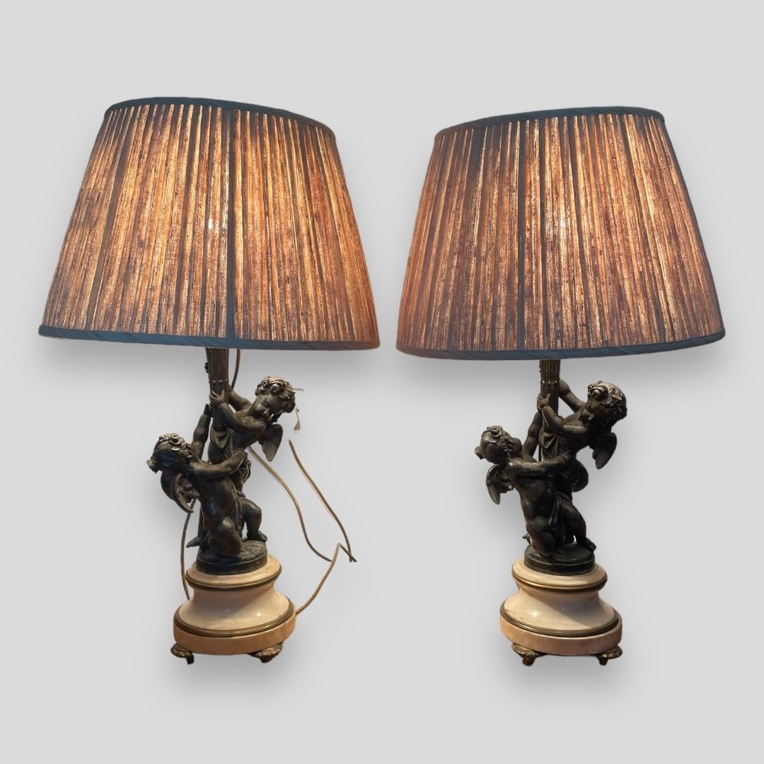 A Stunning Pair Of Cherub Lamps With Marble And Brass Bases