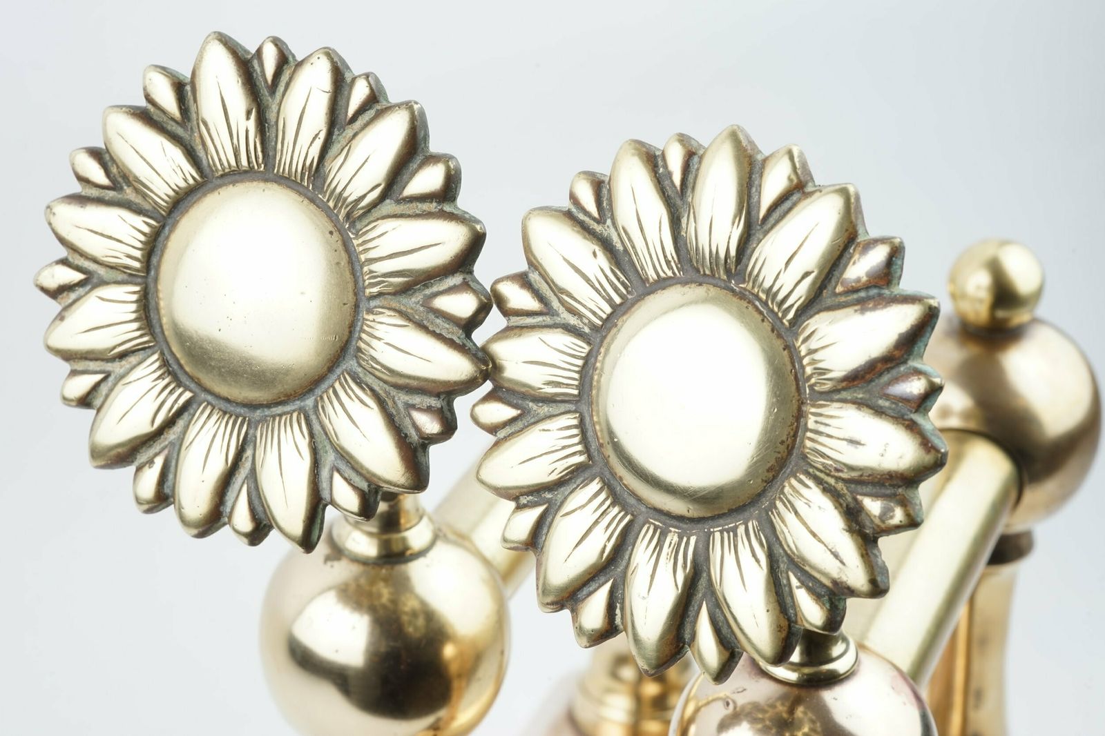 photo furniture A Pair Of Aesthetic Movement Sunflower Brass Fire Dogs, Circa 1875