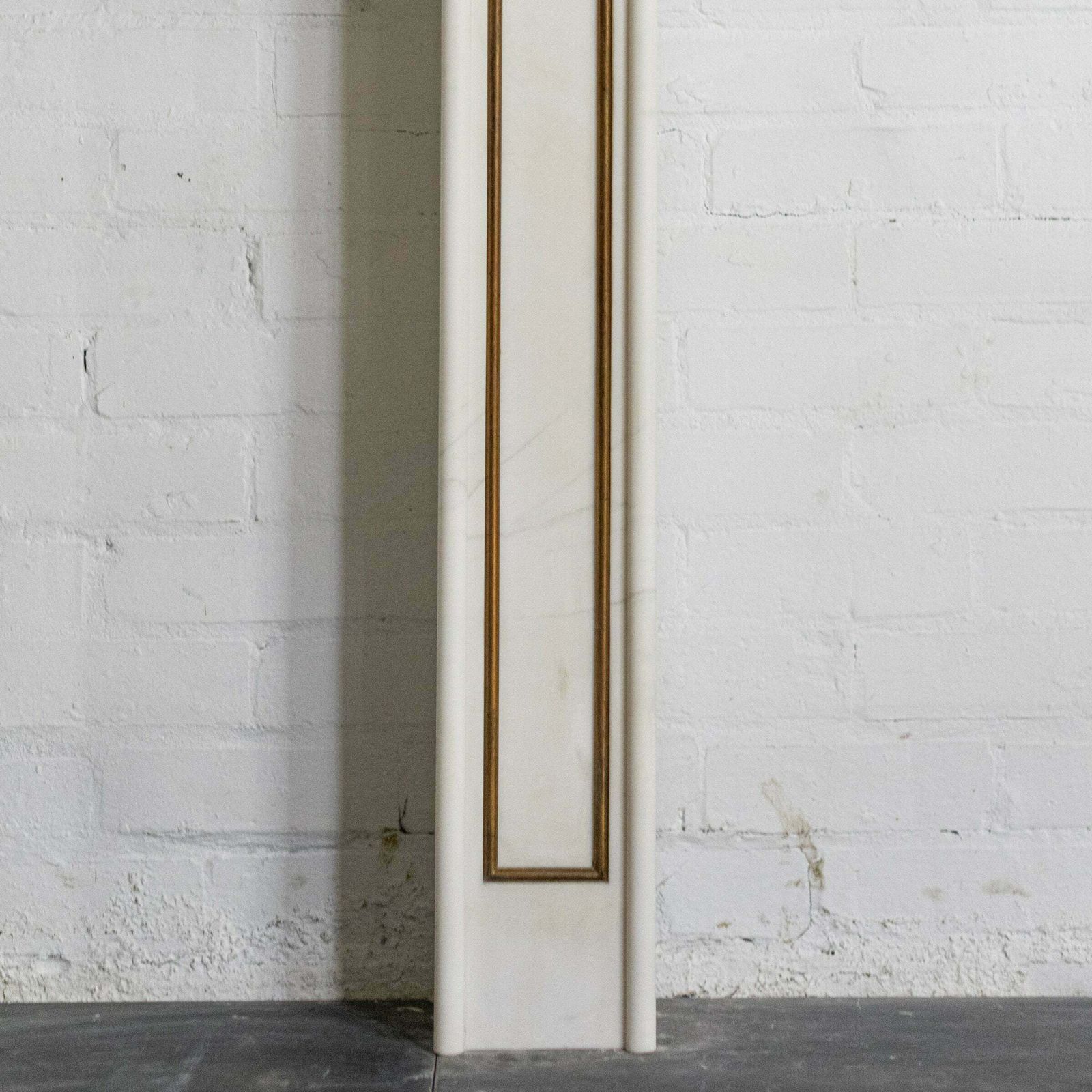 Home Fixtures Reclaimed Statuary Marble Fireplace Surround With Brass Detail photo