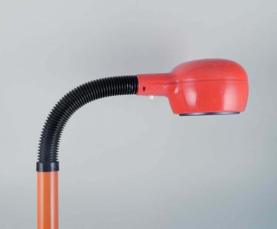 Fagerhults, Sweden. Retro Designer Desk Lamp In Orange Plastic. photo for sale