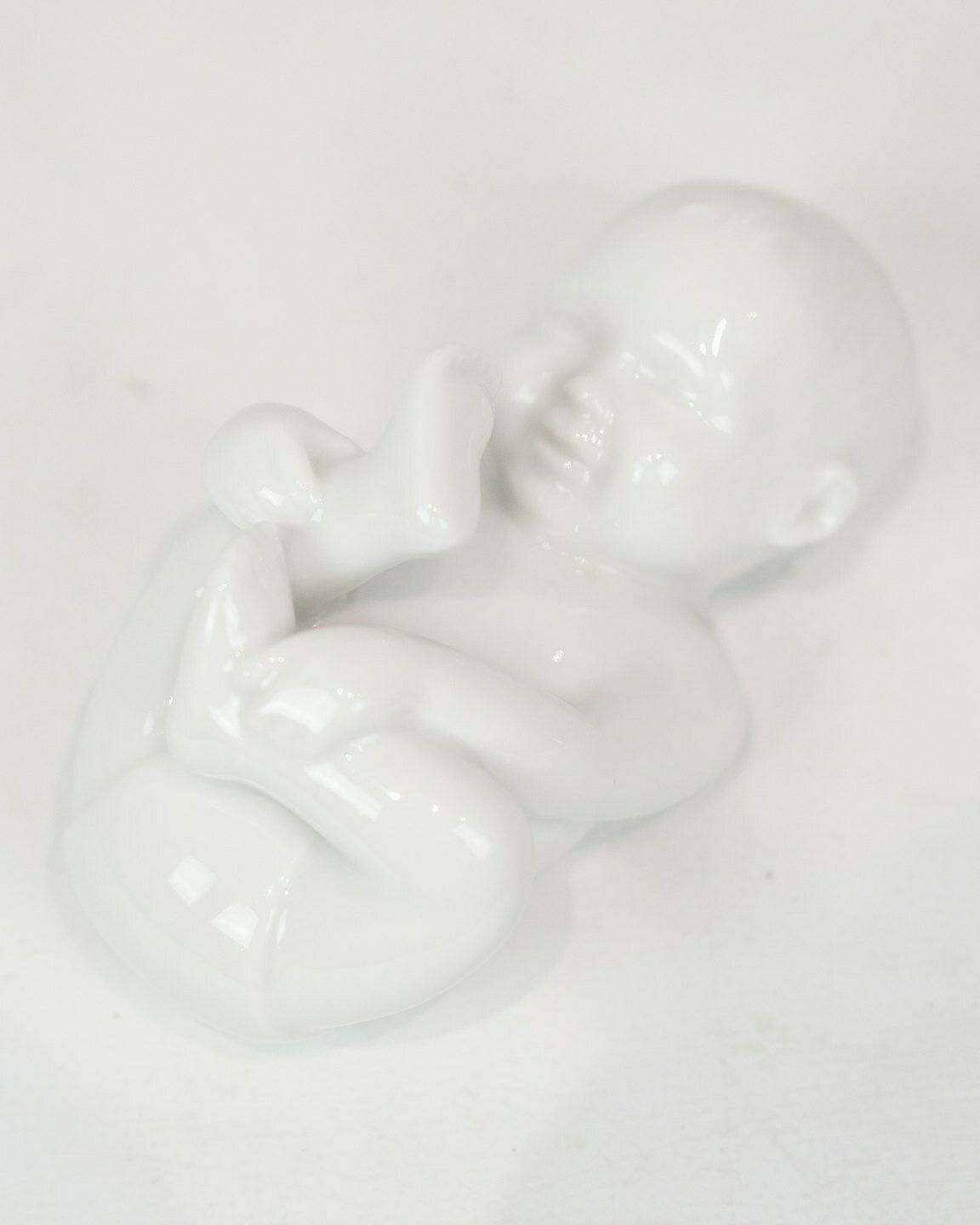 Porcelain Figure Babbling Baby In White Glaze By Allan Therkelsen photo for sale