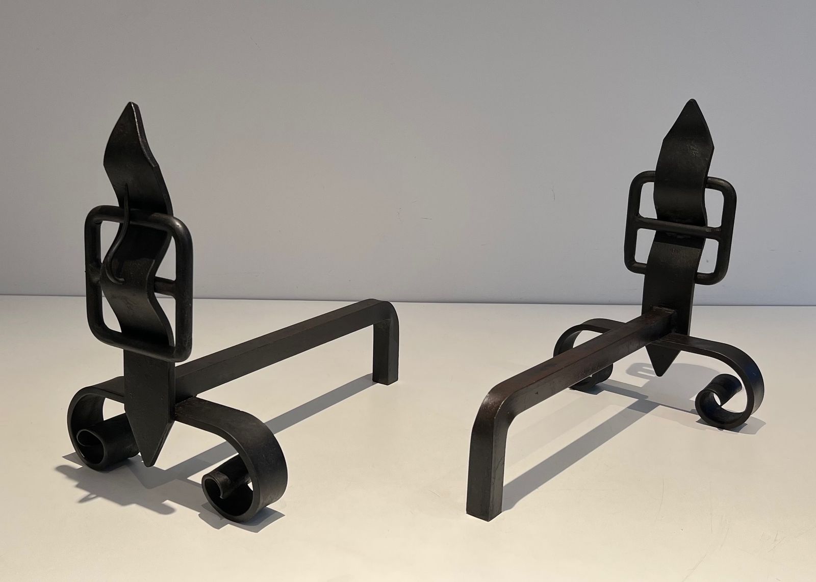 Pair Of Modernist Andirons Representing A Belt photo Home Fixtures