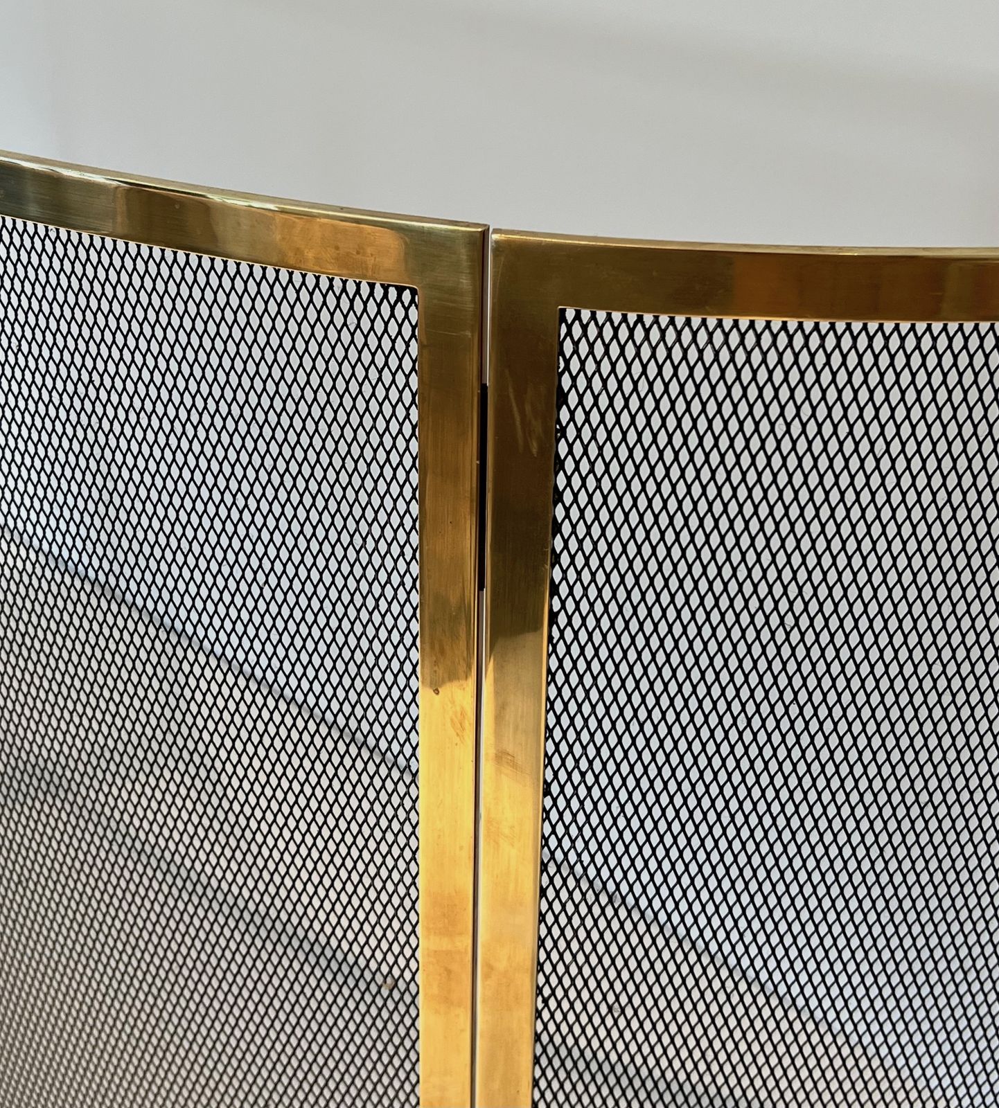 photo furniture Curved Brass Firewall And Wire Mesh