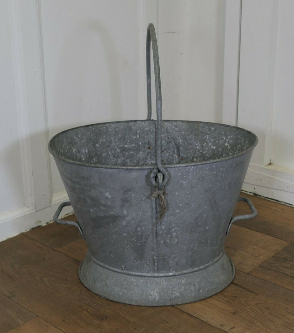 A Large Galvanised Housemaid’s Bucket photo furniture