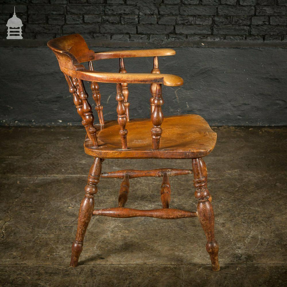900.0 19th C Elm Captains Bow Seat Smokers Chair With Turned Arm Support And Double H Stretcher photo