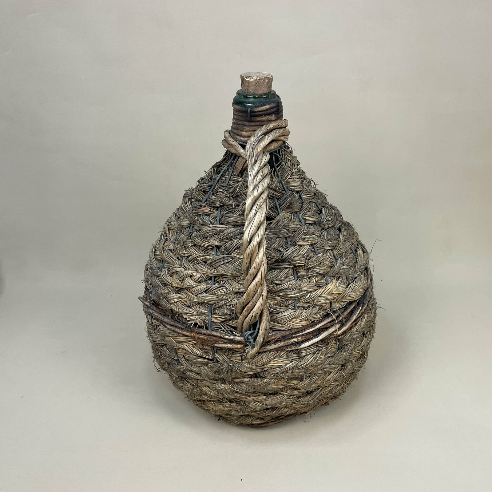 Antique Demijohn Carboy Wine Jug Wicker Cover Green Glass Bottle Handle Woven Metal Cage Vintage Decorative Ornament Seagrass Woven photo for sale