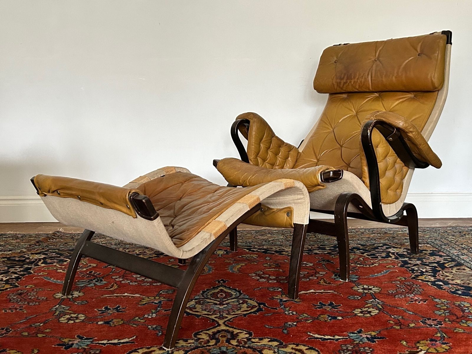 A Pernilla Leather Lounge Chair And Footstool By Bruno Mathsson For Dux, 1960s.