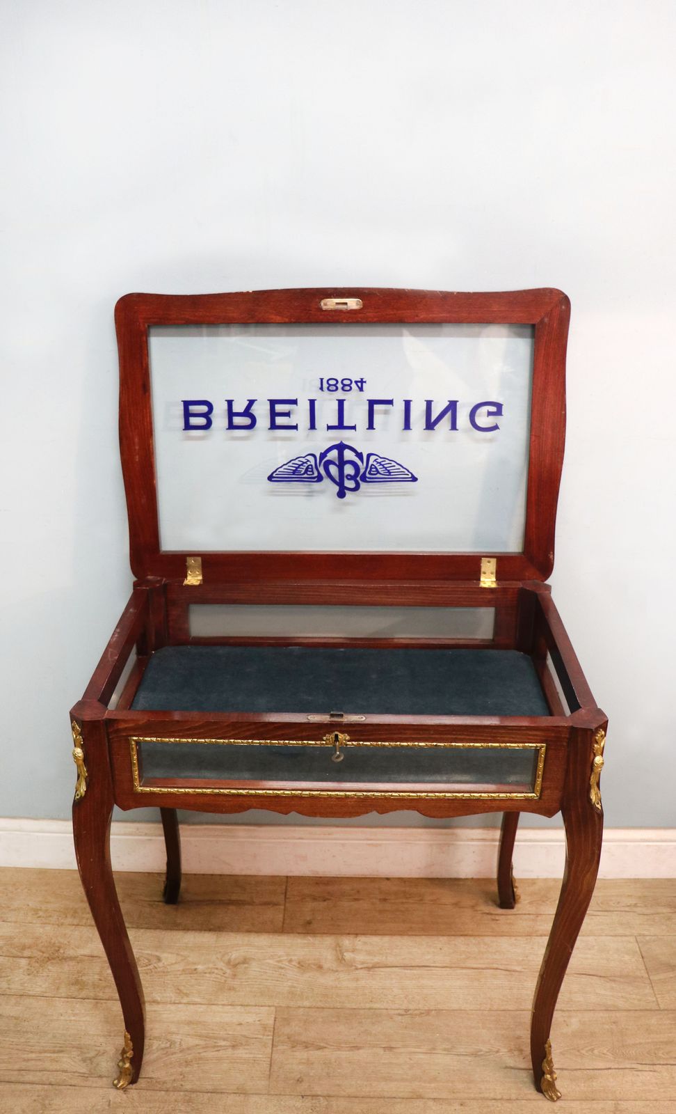 A Lovely 20th Century French Hardwood Bijouterie Display Table Later Sign Written For Breitling Watches. photo vinterior