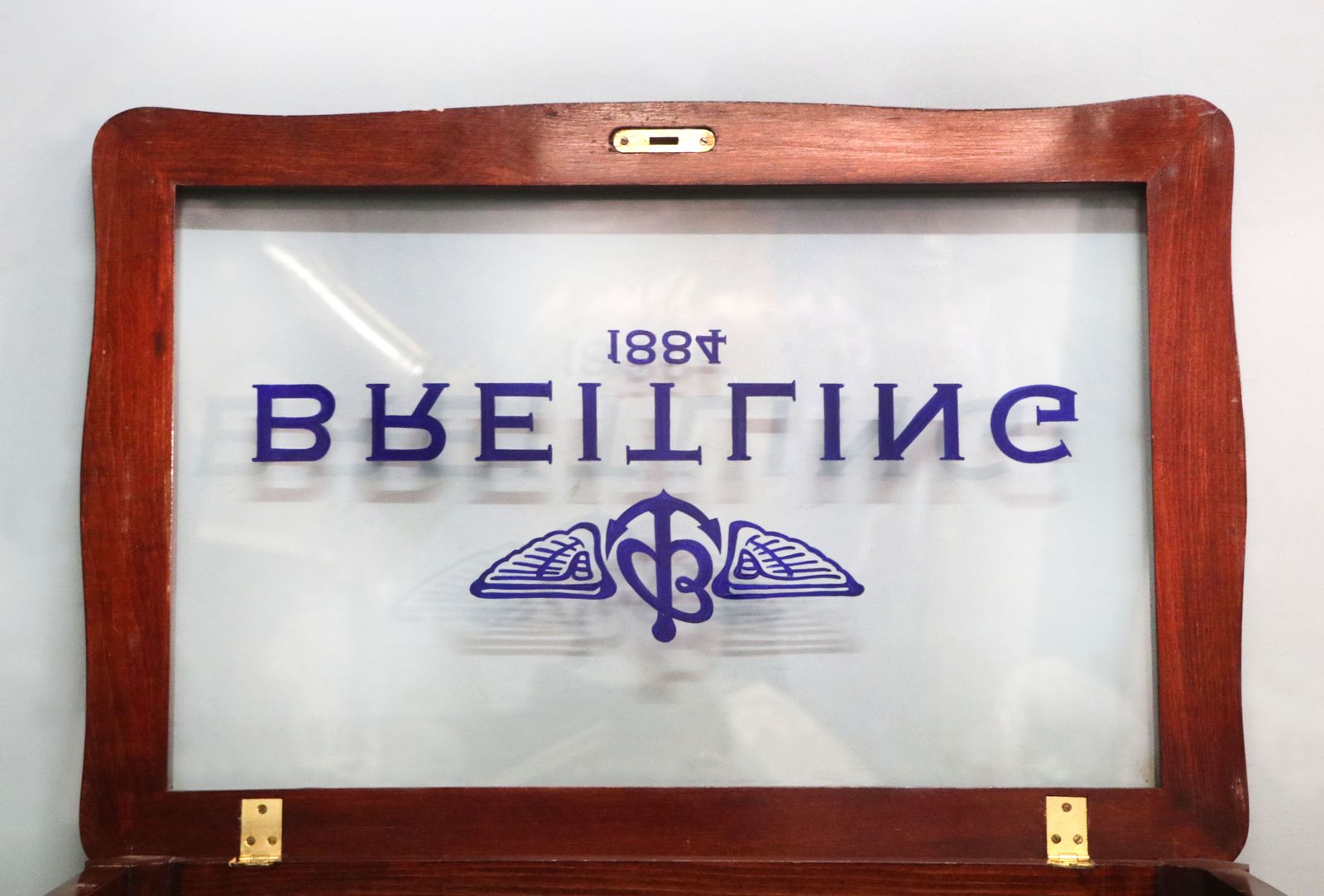 photo vintage A Lovely 20th Century French Hardwood Bijouterie Display Table Later Sign Written For Breitling Watches.