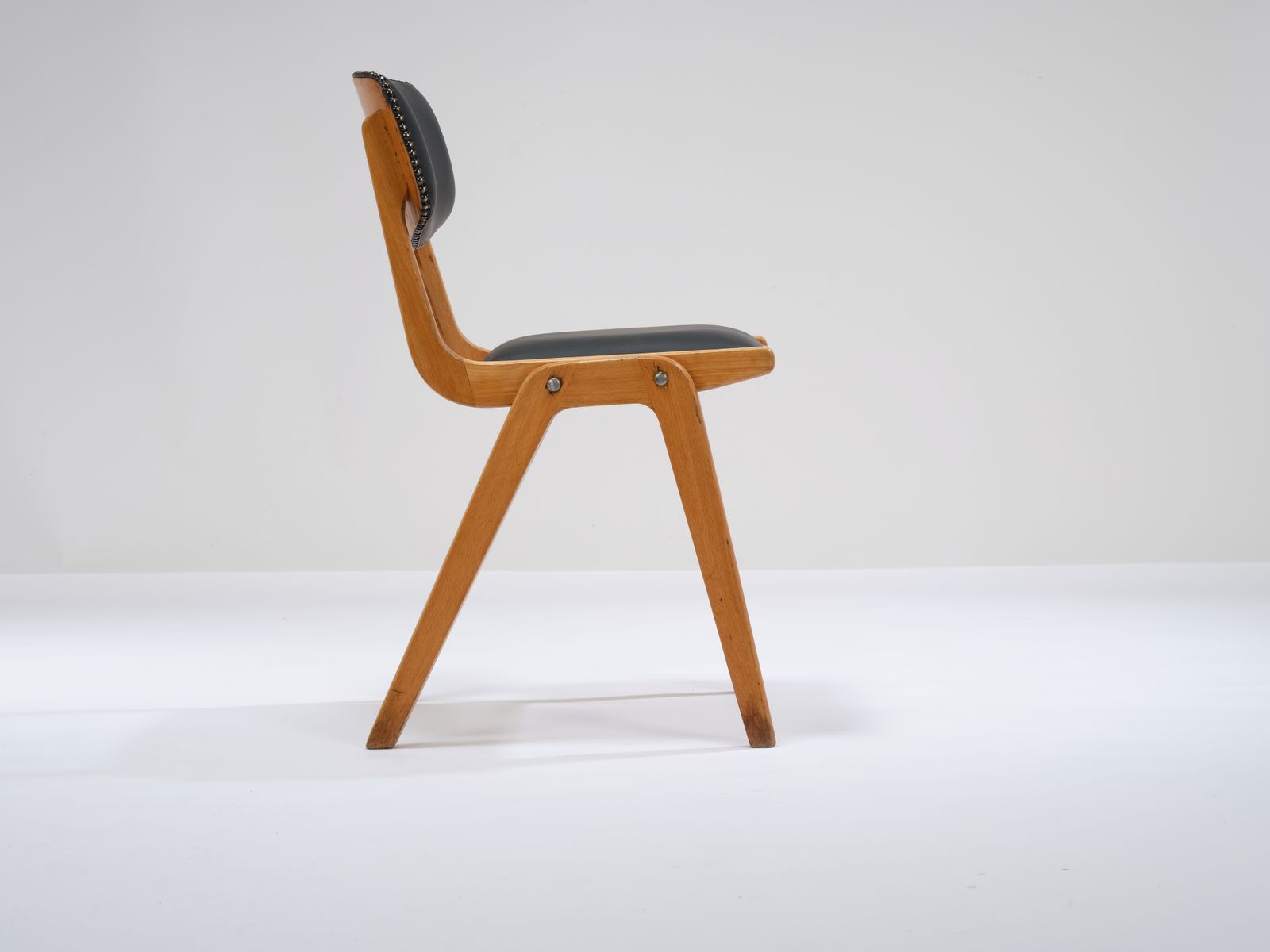 375.0 Vintage Stackable Beech 'Ben Cafe Chair' Reupholstered In Soft Expresso Leather With Stud Detailing, Circa 1960's, 8 Available. photo