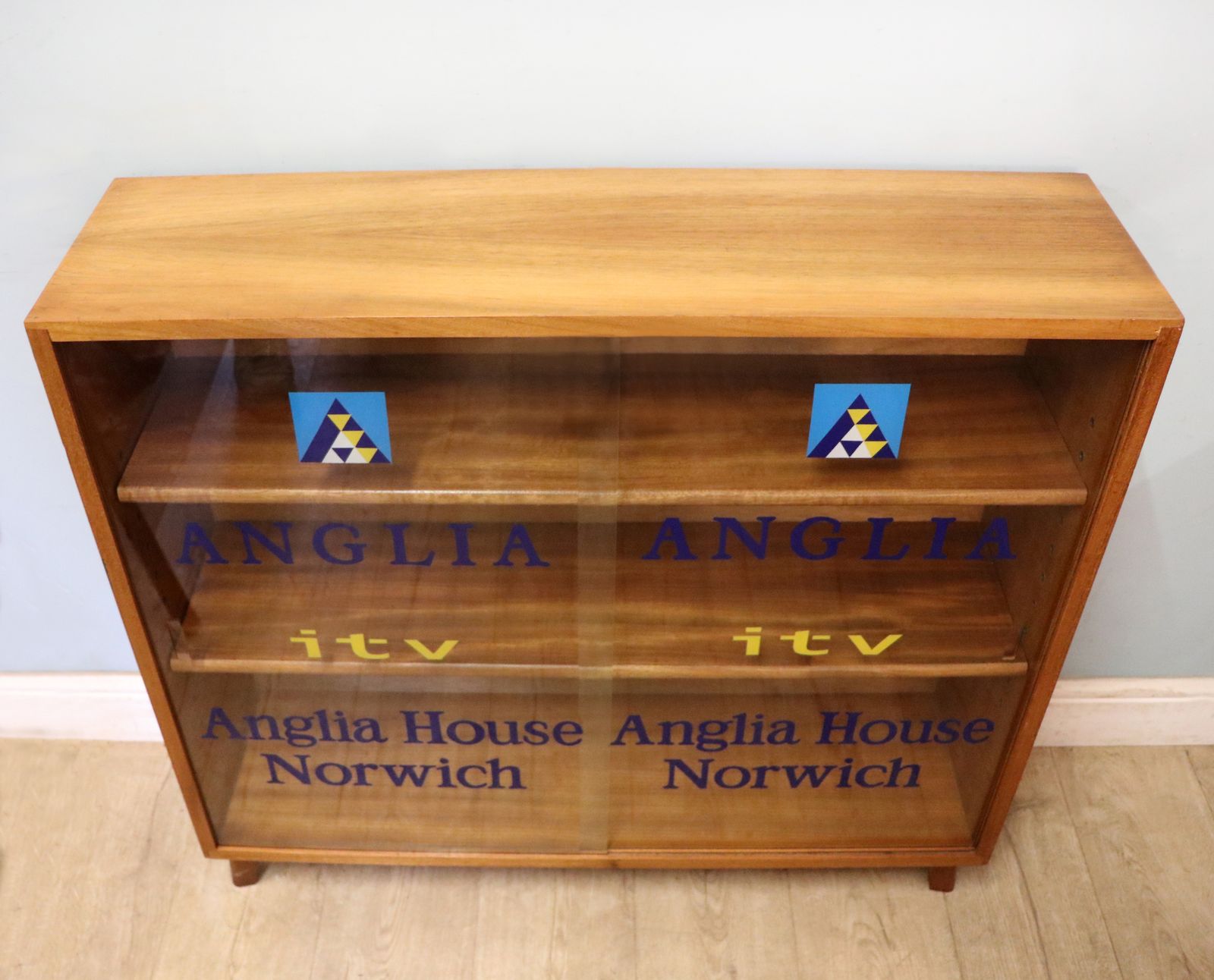 A Lovely Quality Mid Century Bookcase Cabinet,  Later Sign Written For Anglia Television. photo furniture