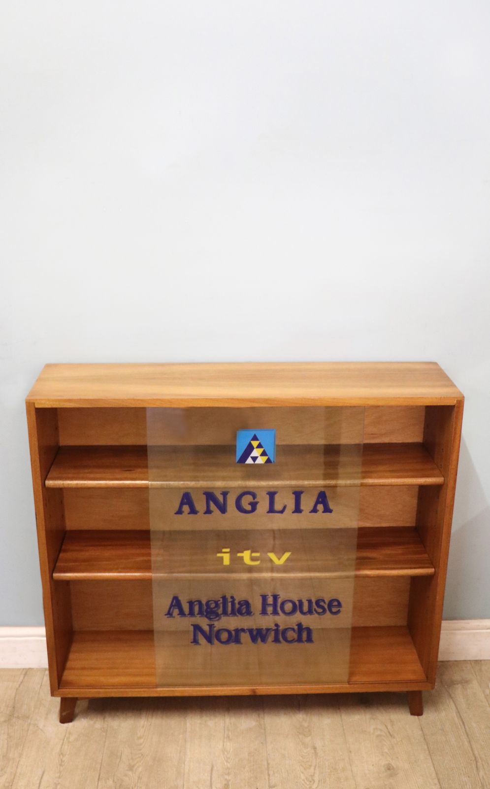 A Lovely Quality Mid Century Bookcase Cabinet,  Later Sign Written For Anglia Television. photo for sale