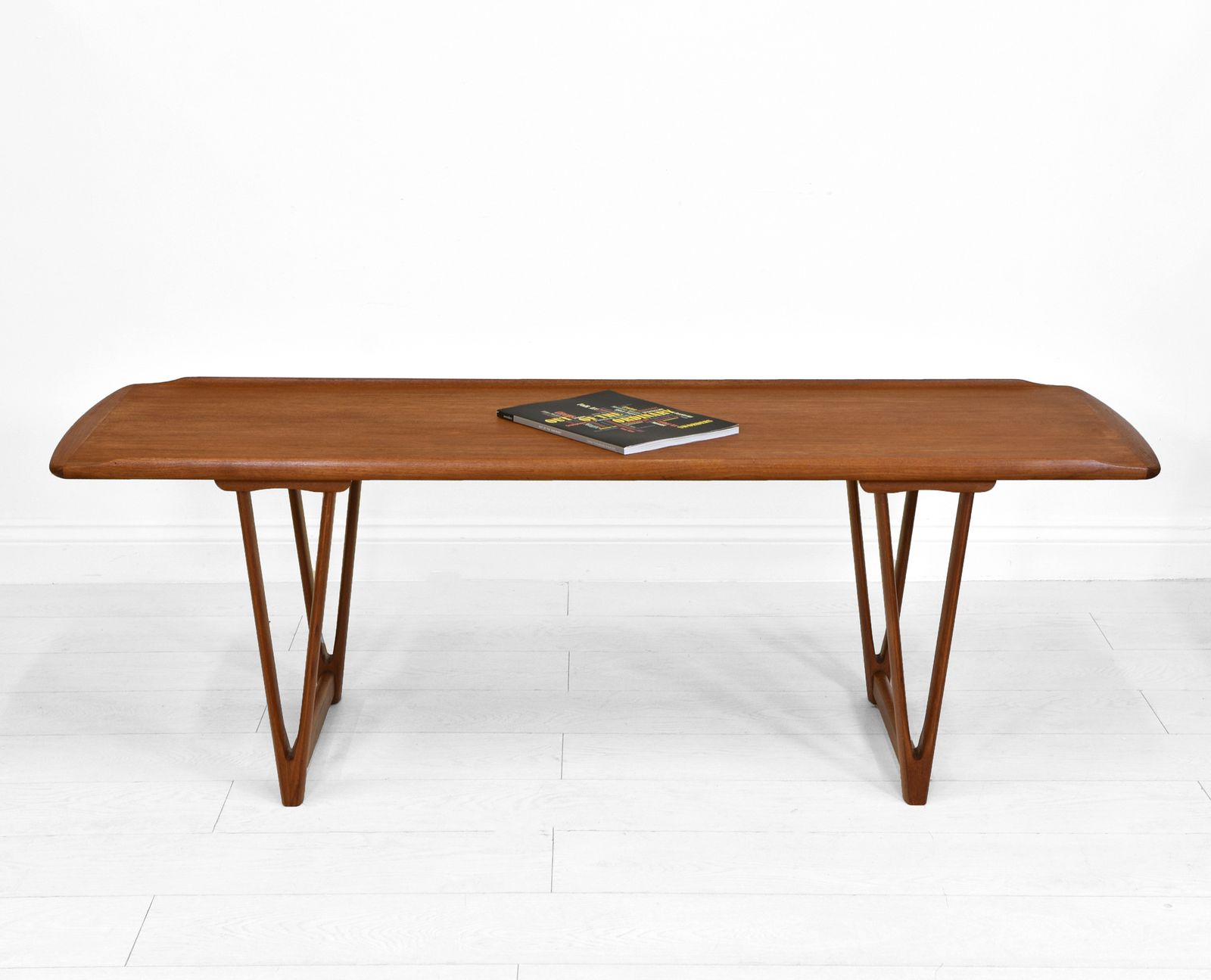 Mid Century Danish Teak Coffee Table On V Shape Supports And Lipped Top Edge