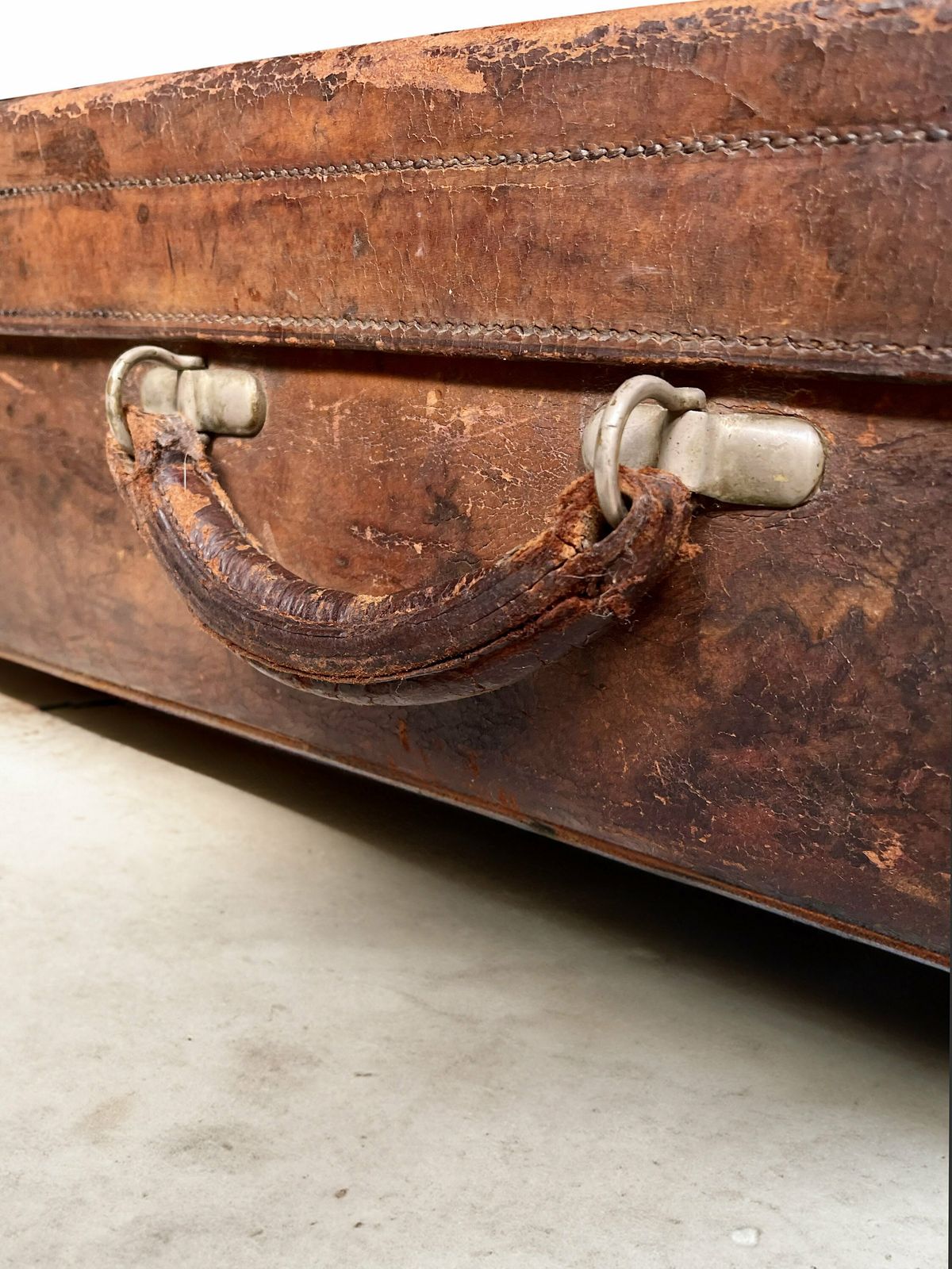 Vintage/Antique Large Heavy Tan Leather Suitcase Stamped Army And Navy London With Stickers Circa 1930 photo for sale