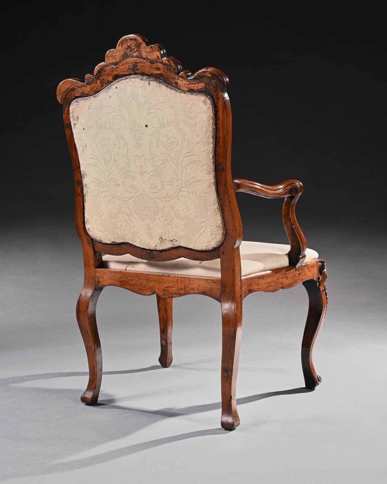 Mid 18th Century Italian Rococo Armchair In Walnut With Extravagantly Carved Head Rail photo Furniture