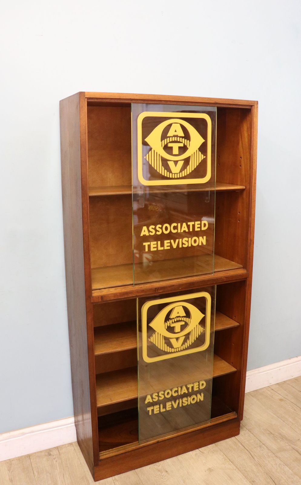 A Lovely Mid Century Display Cabinet Later Sign Written With The Emblems And Wording For Associated Television. photo 595.0