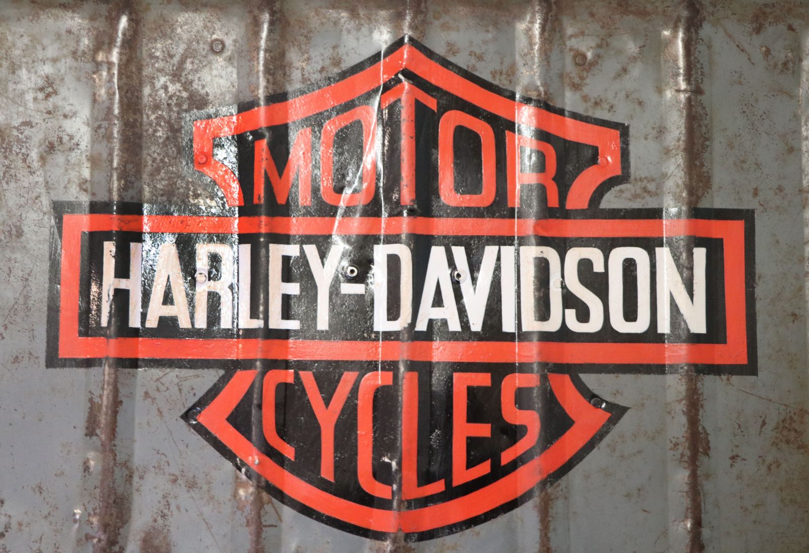 A Lovely Vintage Metal Trunk Which Has Been Later Hand Sign Written With The Harley Davidson Emblem. photo furniture