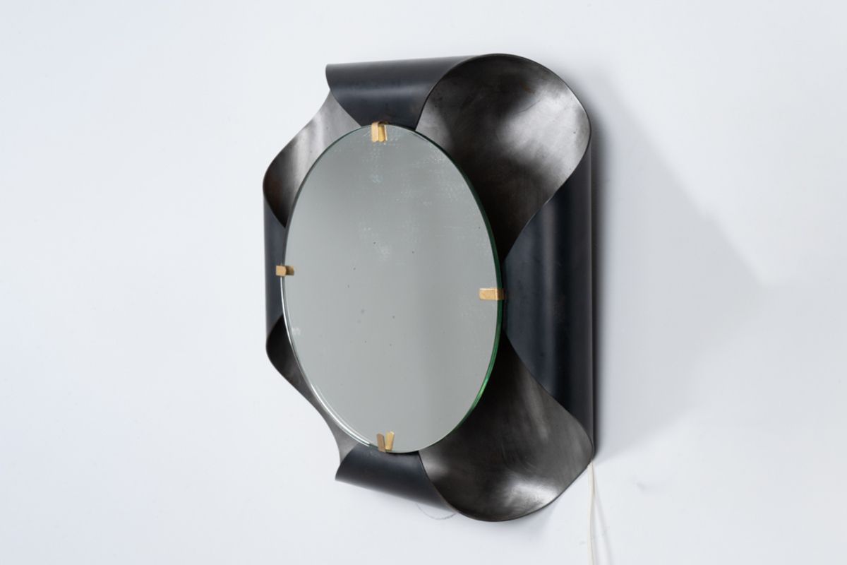 Mirror In Curved Metal And Golden Brass. 1970s. photo for sale