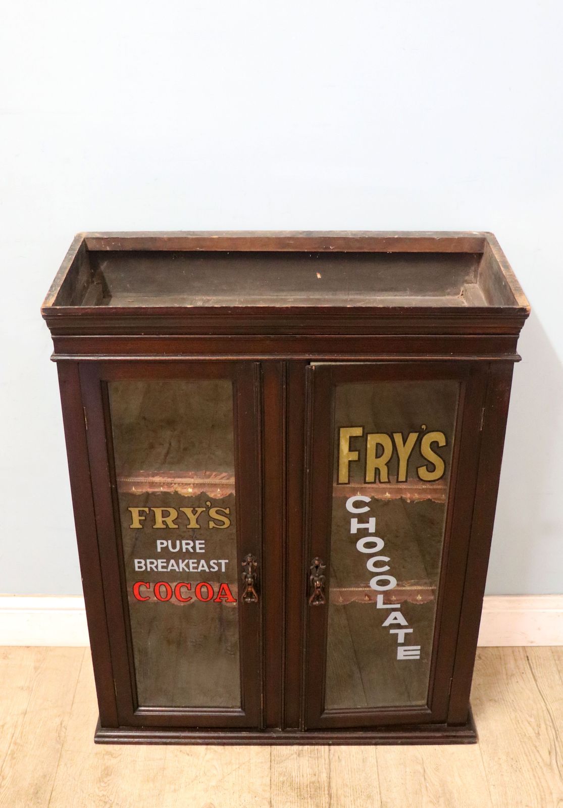 A Very Nice Victorian Glazed Shopfitting Cabinet, Hand Sign Written With Advertising For Fry’s Chocolate,