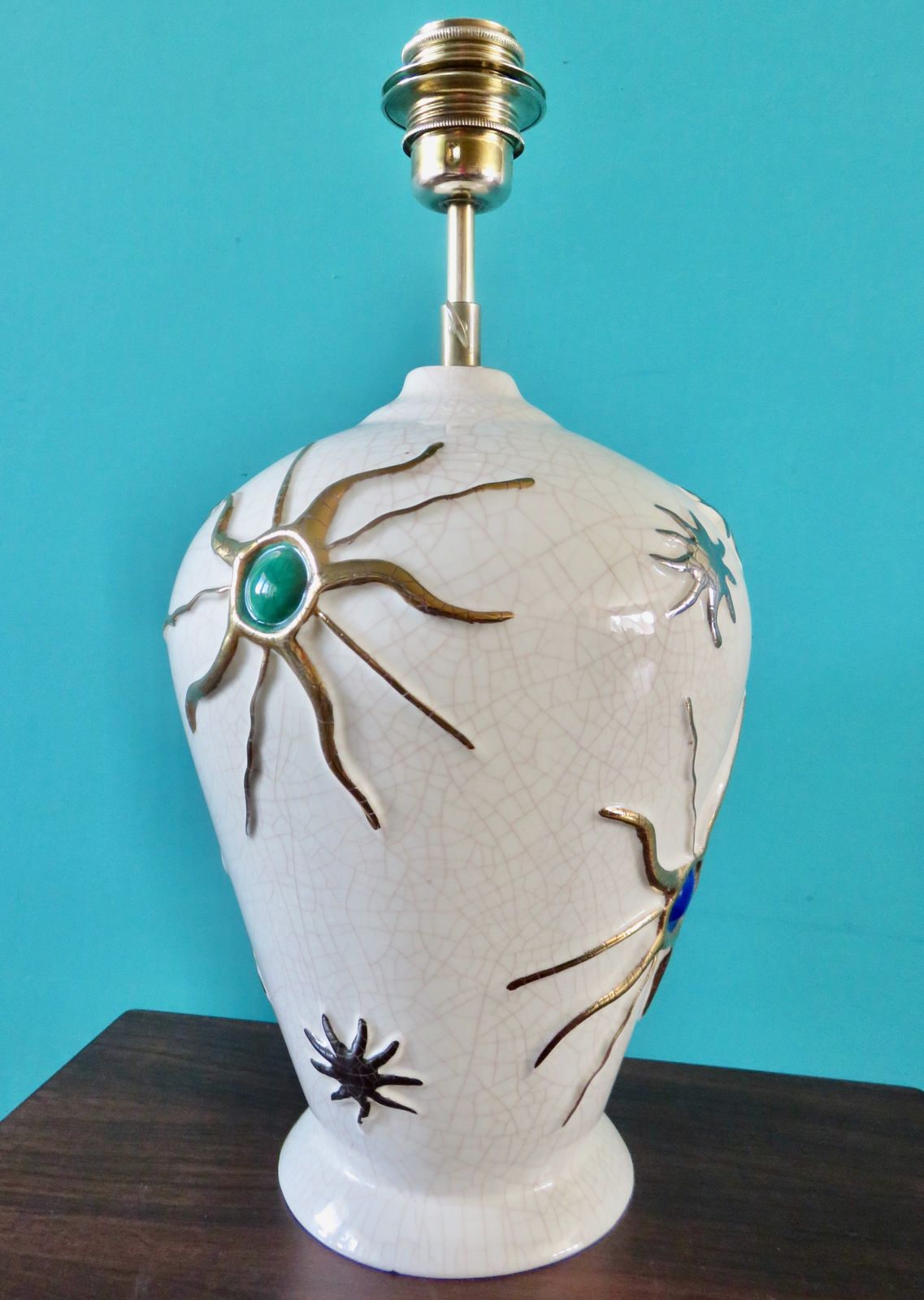 Large Ecru Cracked "Longwy" Earthenware Lamp With Bas Relief Of Suns And Stars. France 1945 1950 photo Lighting