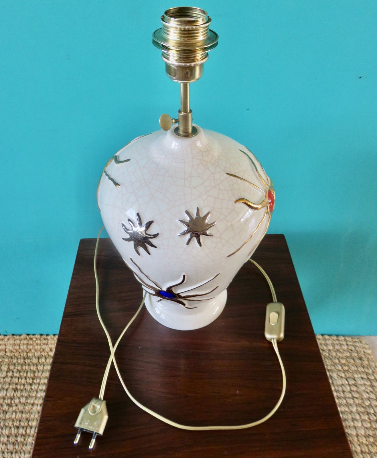 photo for sale Large Ecru Cracked "Longwy" Earthenware Lamp With Bas Relief Of Suns And Stars. France 1945 1950