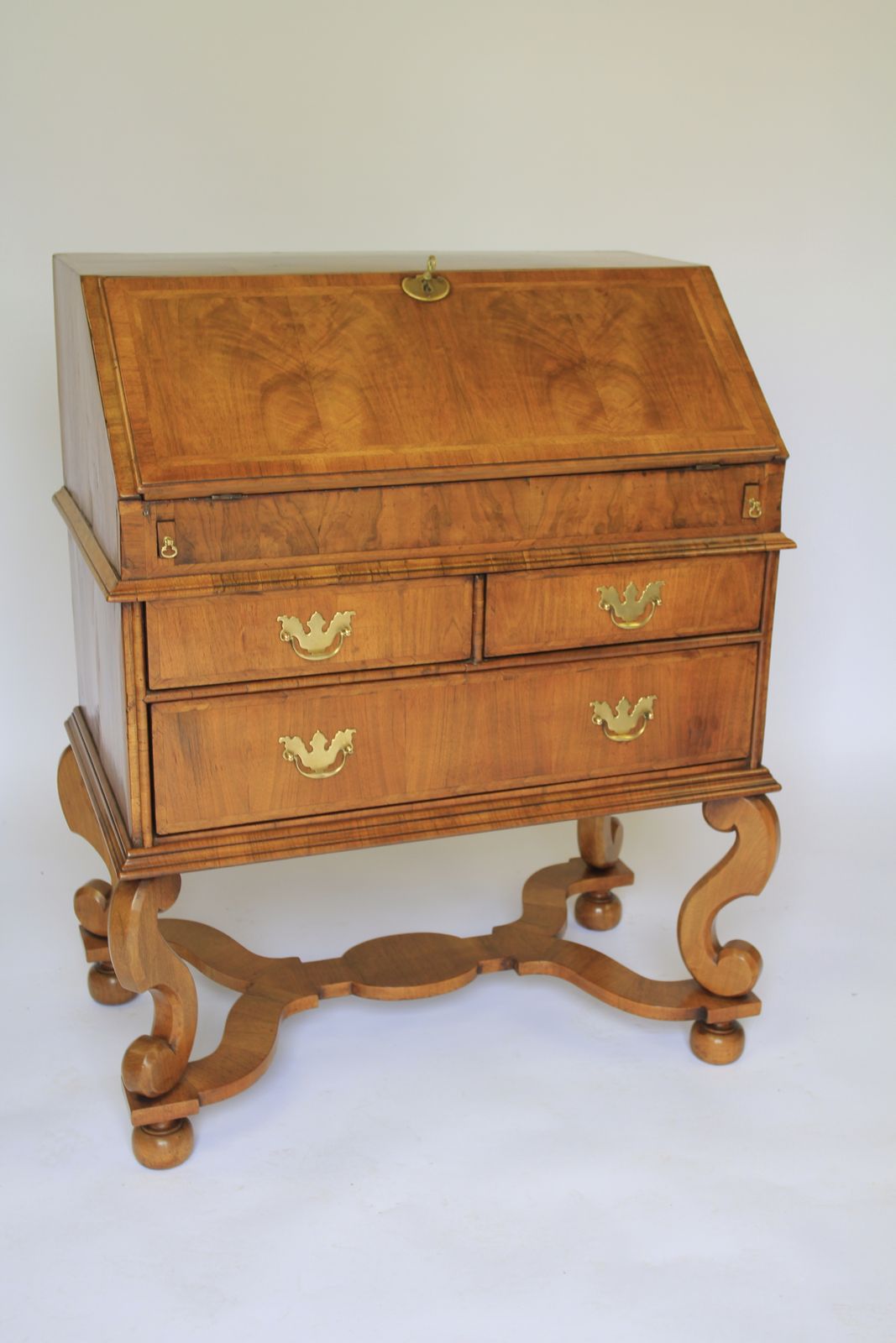 Walnut William & Mary Revival Bureau With Well