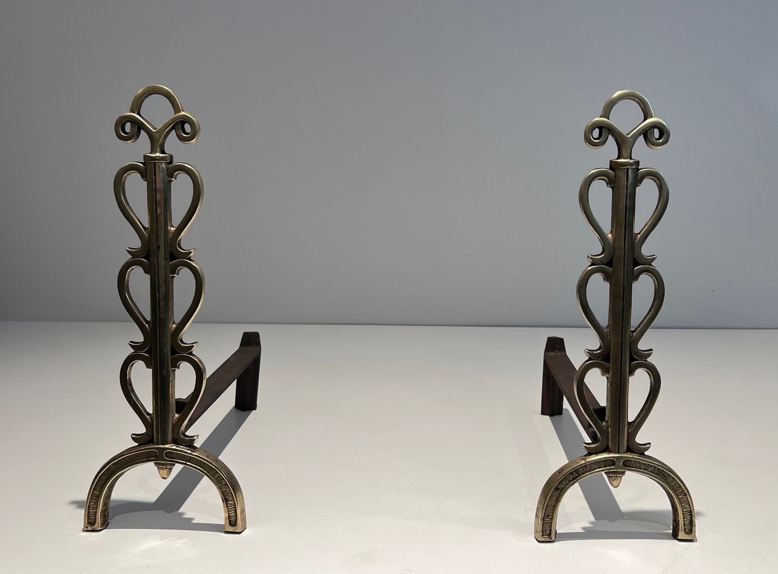 photo buy Pair Of Andirons In Brass And Wrought Iron In The Style Of Raymond Subes