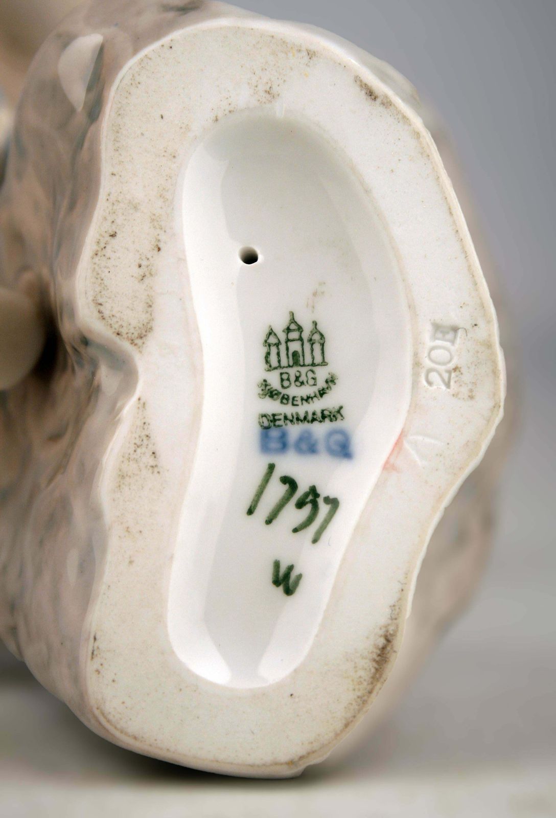 photo furniture Mid 20th Century Scandinavian Modern Glazed Porcelain Sculpture Of A Boy Sitting On A Rock By Danish Company Bing & Grøndahl