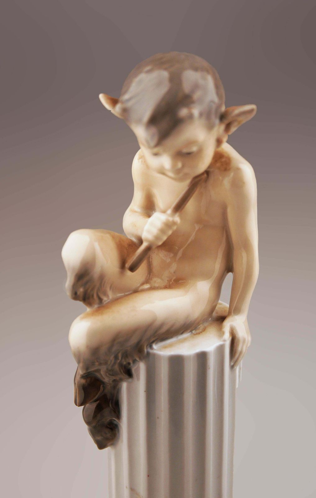 Mid 20th Century Danish Glazed Porcelain Sculpture Of Faun (Satyr) Sitting Over A Column And A Rabbit By Danish Firm Royal Copenhagen photo 500.0