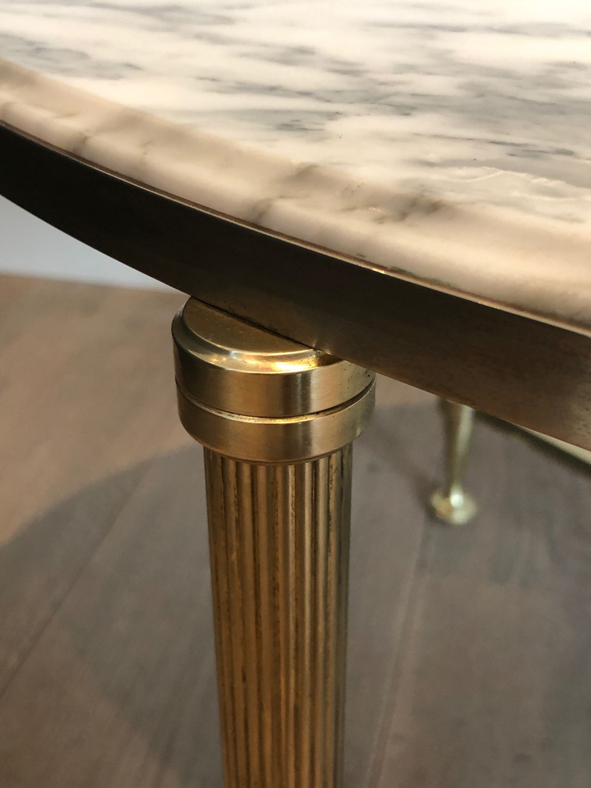 photo furniture Neoclassical Style Oval Coffee Table In Brass And Carrara Marble Top From Maison Jansen