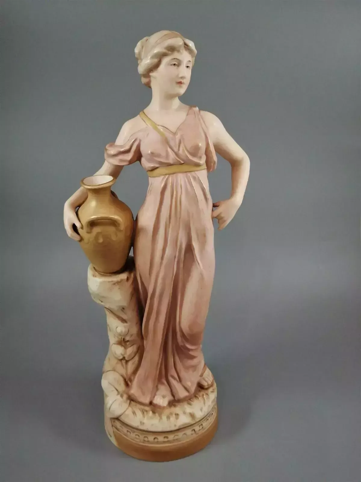 Beautiful Antique Royal Dux Porcelain Figurine Depicting A Lady Holding A Jug.
