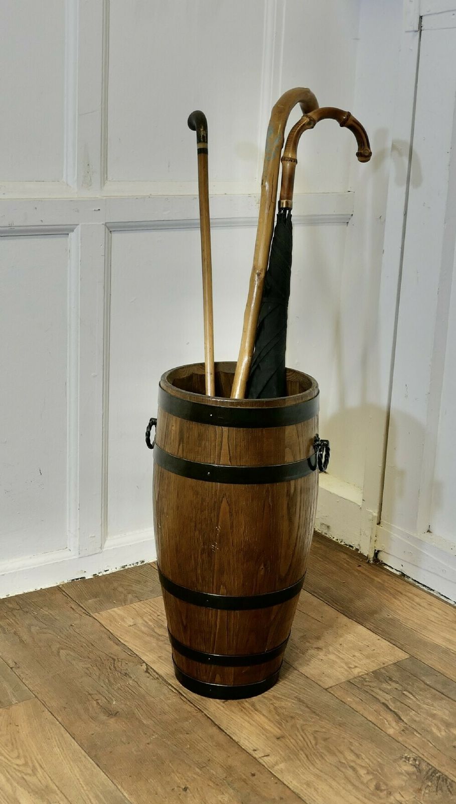 A Large Golden Oak Iron Bound Barrel Stick Stand