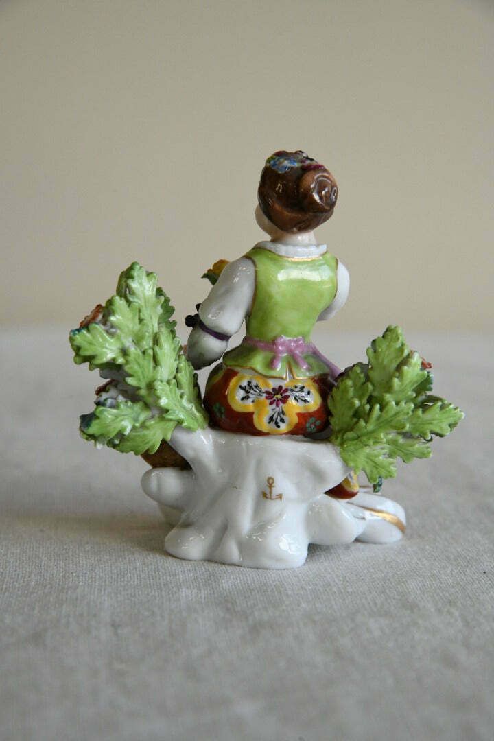 Ornament Girl And Basket Of Flowers photo for sale