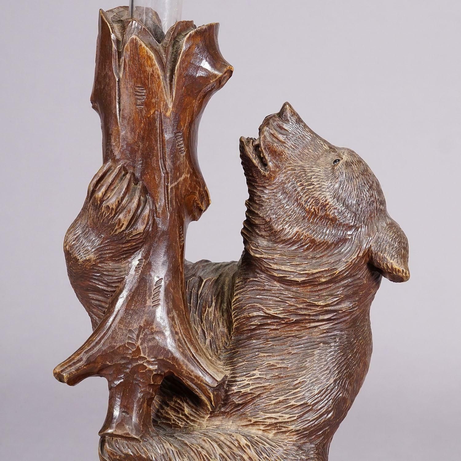 photo furniture A Wooden Carved Black Forest Bear With Glass Vase Ca. 1900s
