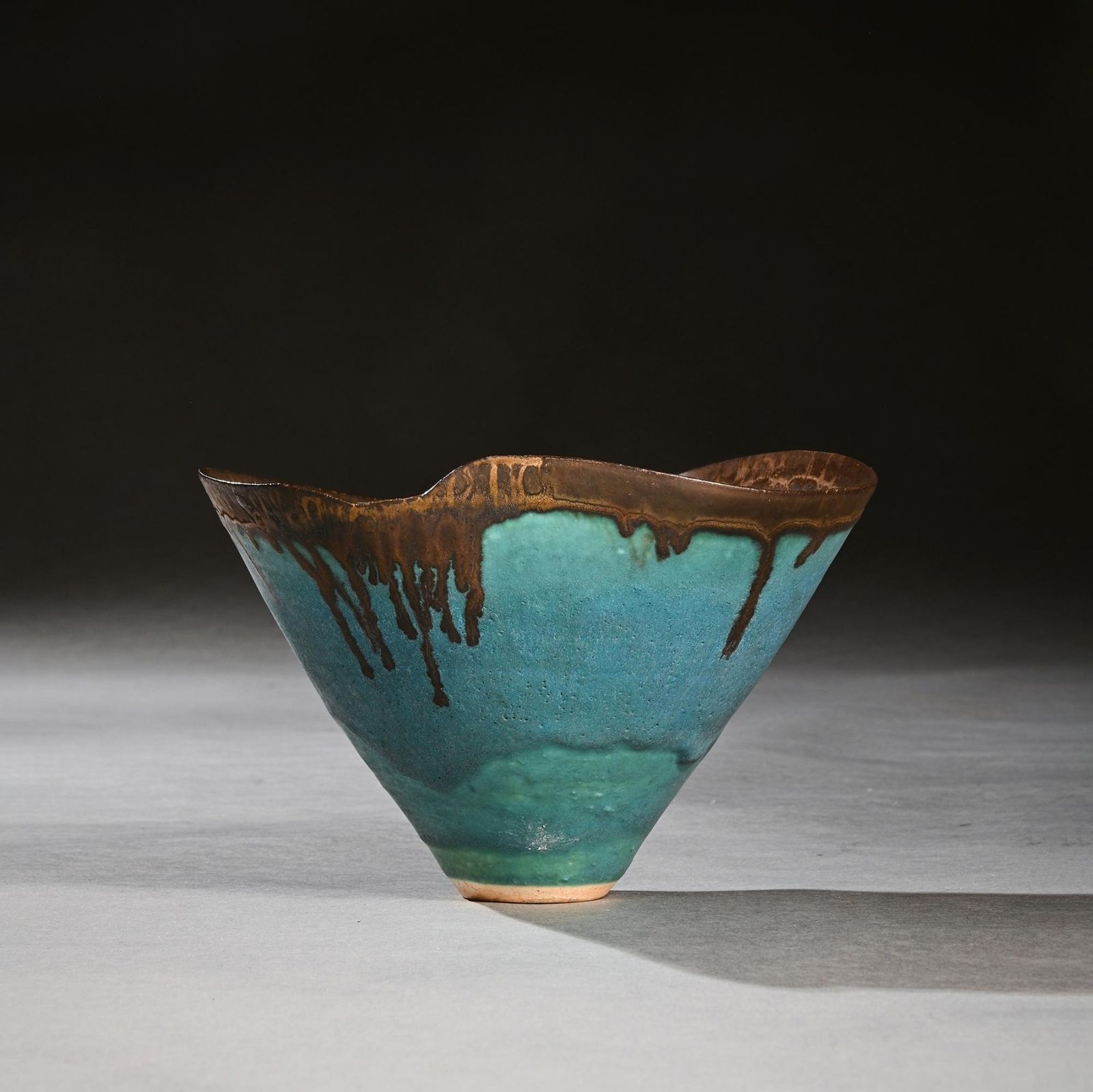 photo furniture A Fine Dame Lucie Rie Turquoise Blue Stoneware Bowl With Dripping Manganese Glaze And Wavy Rim