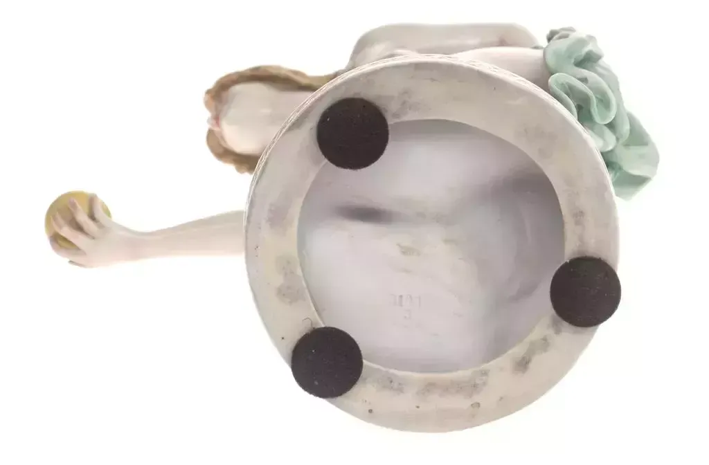 Porcelain Figurine A Woman Who Plays With The Ball photo for sale
