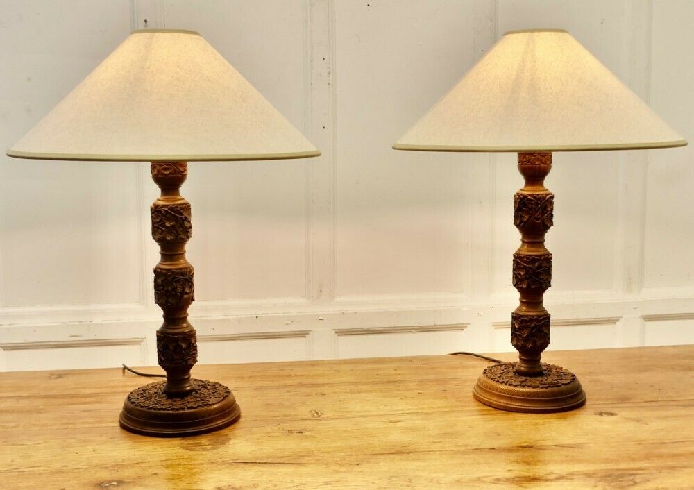 A Pair Of Teak Carved Tree Of Life Table Lamps