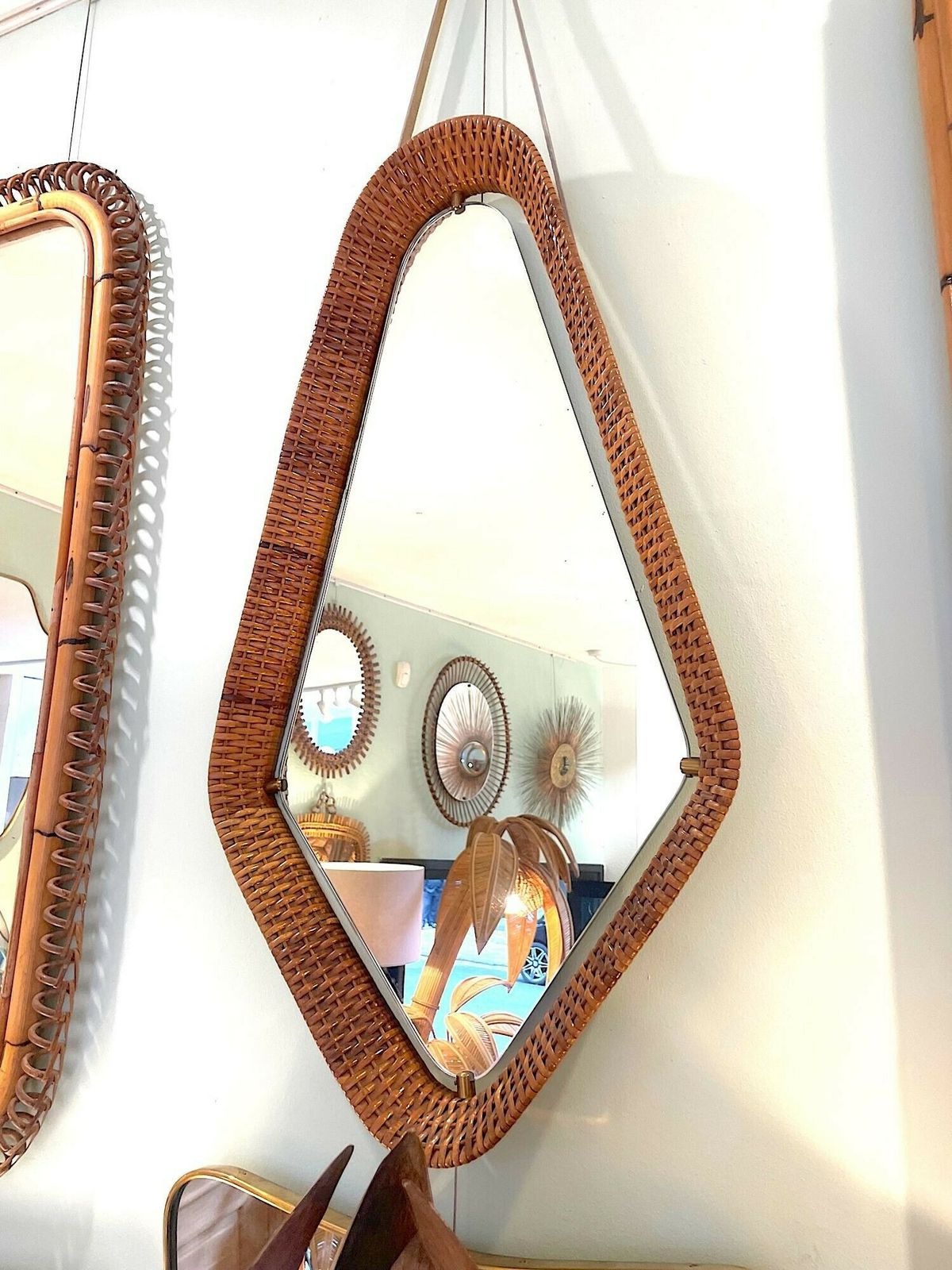 An Unusual Italian 1950s Diamond Shaped Rattan And Brass Framed Mirror With Leather Hanging Strap photo furniture