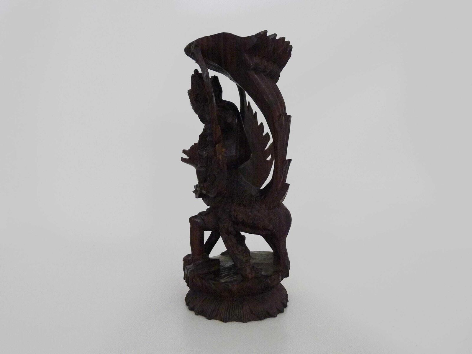 Carved Wooden Statue Of Vishnu Riding Garuda. Bali Indonesia. 1930s photo vintage