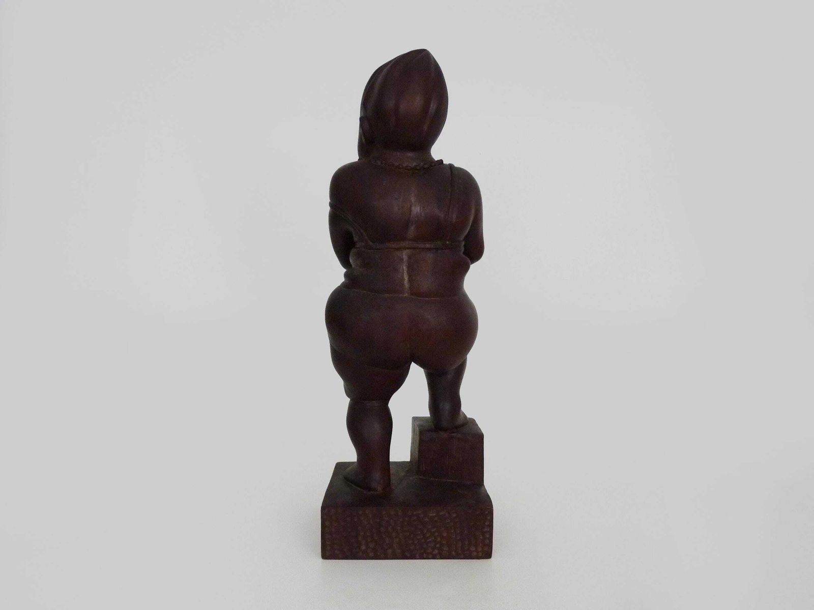 photo for sale Grotesque Exotic Wood Sculpture Of A Woman Showing Her Thigh. 80s. Botero Style