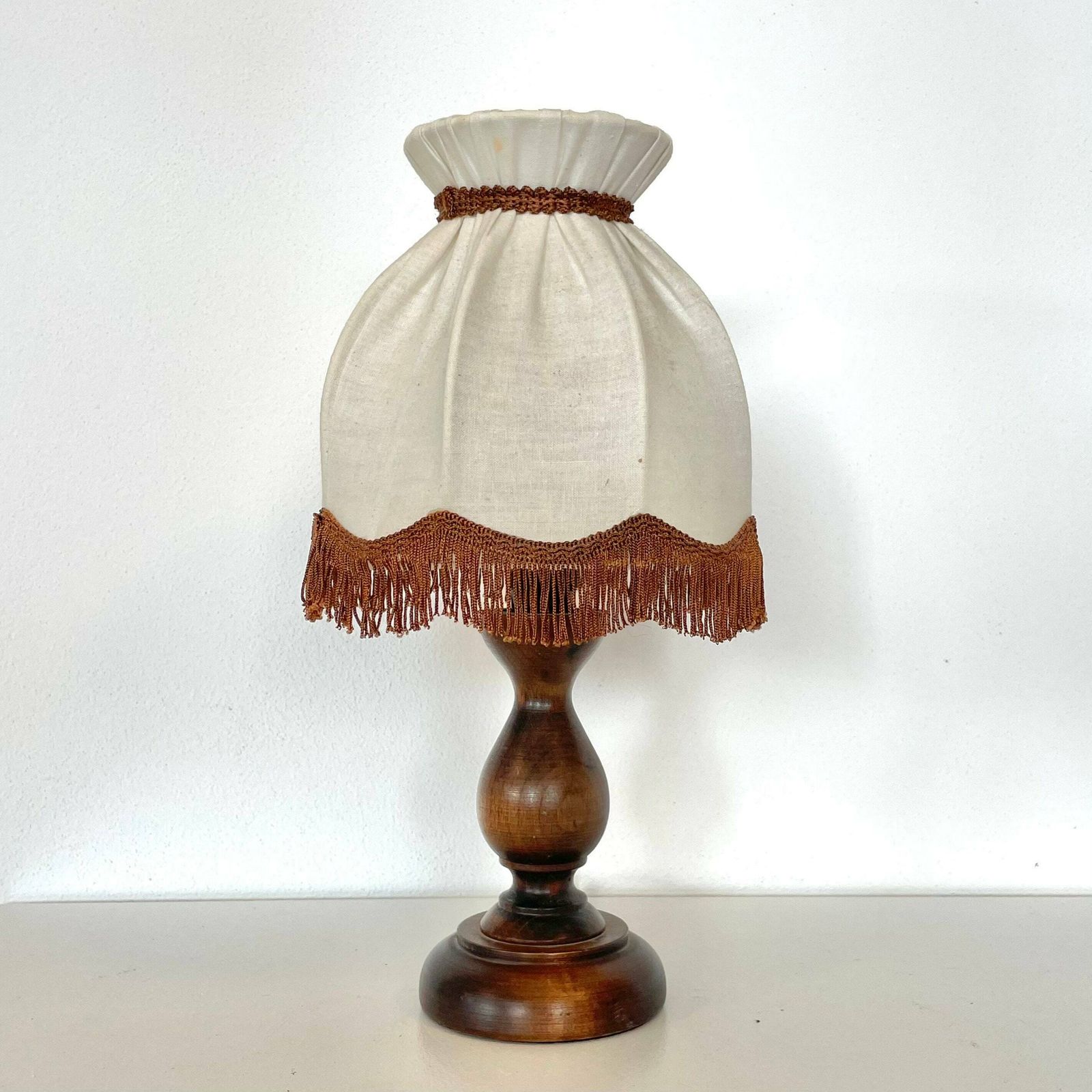 Beautiful Vintage Mid Century Danish Wooden Table Lamp With Carvings And Vintage Beige Fabric Shade With Brown Fringes photo Lighting