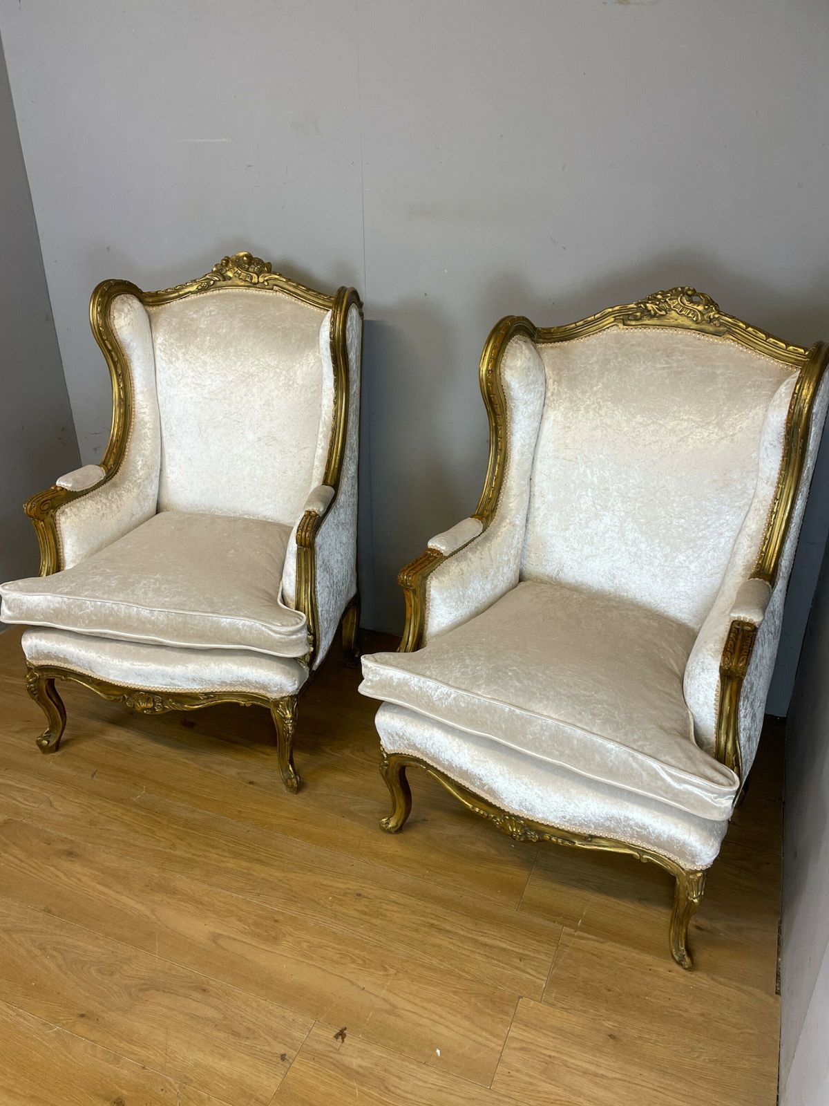 photo for sale Early C20th Pair Of Carved And Gilded French Winged Armchairs