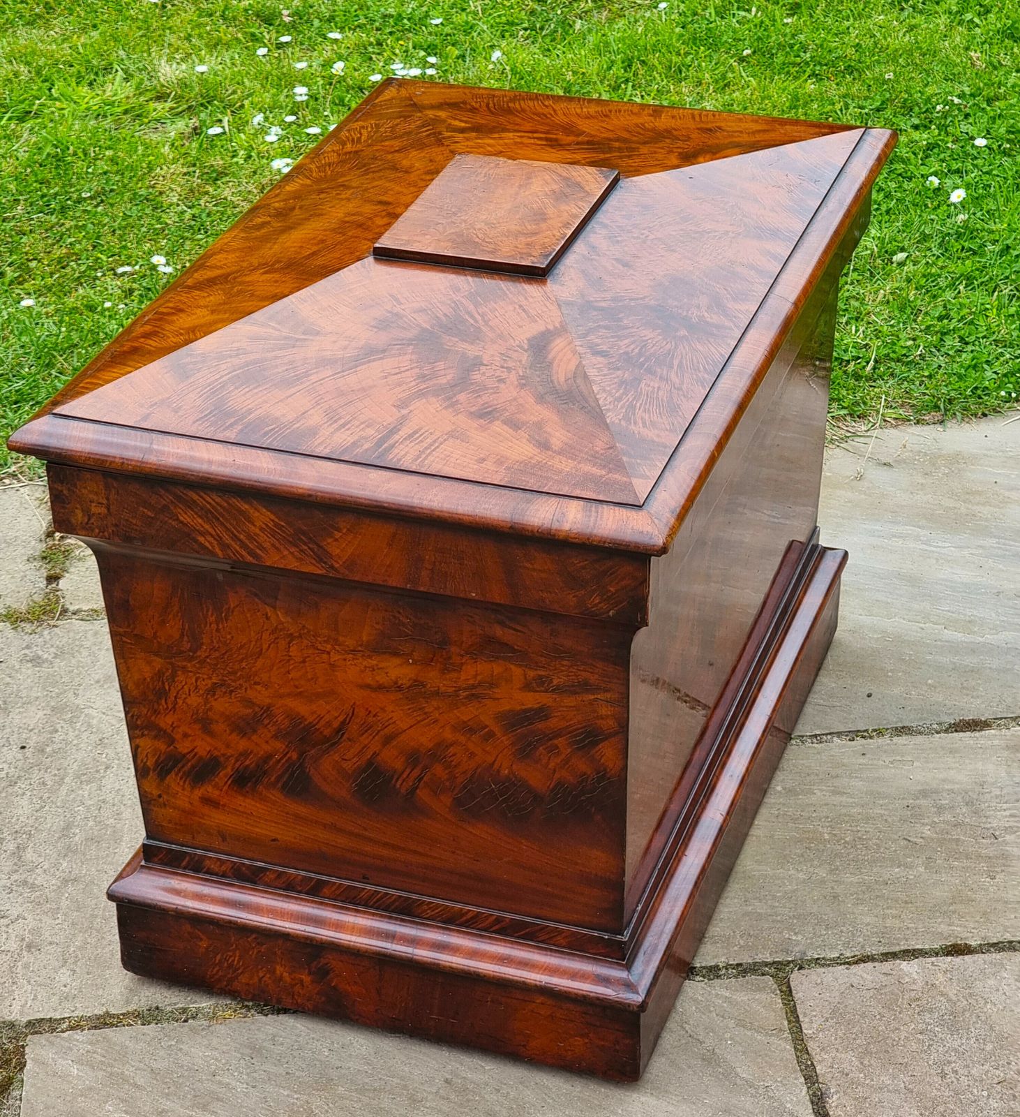 An English Regency Wine Cooler Sarcophagus Shaped And Superbly Veneered In Flame Mahogany, Circa 1820 photo buy