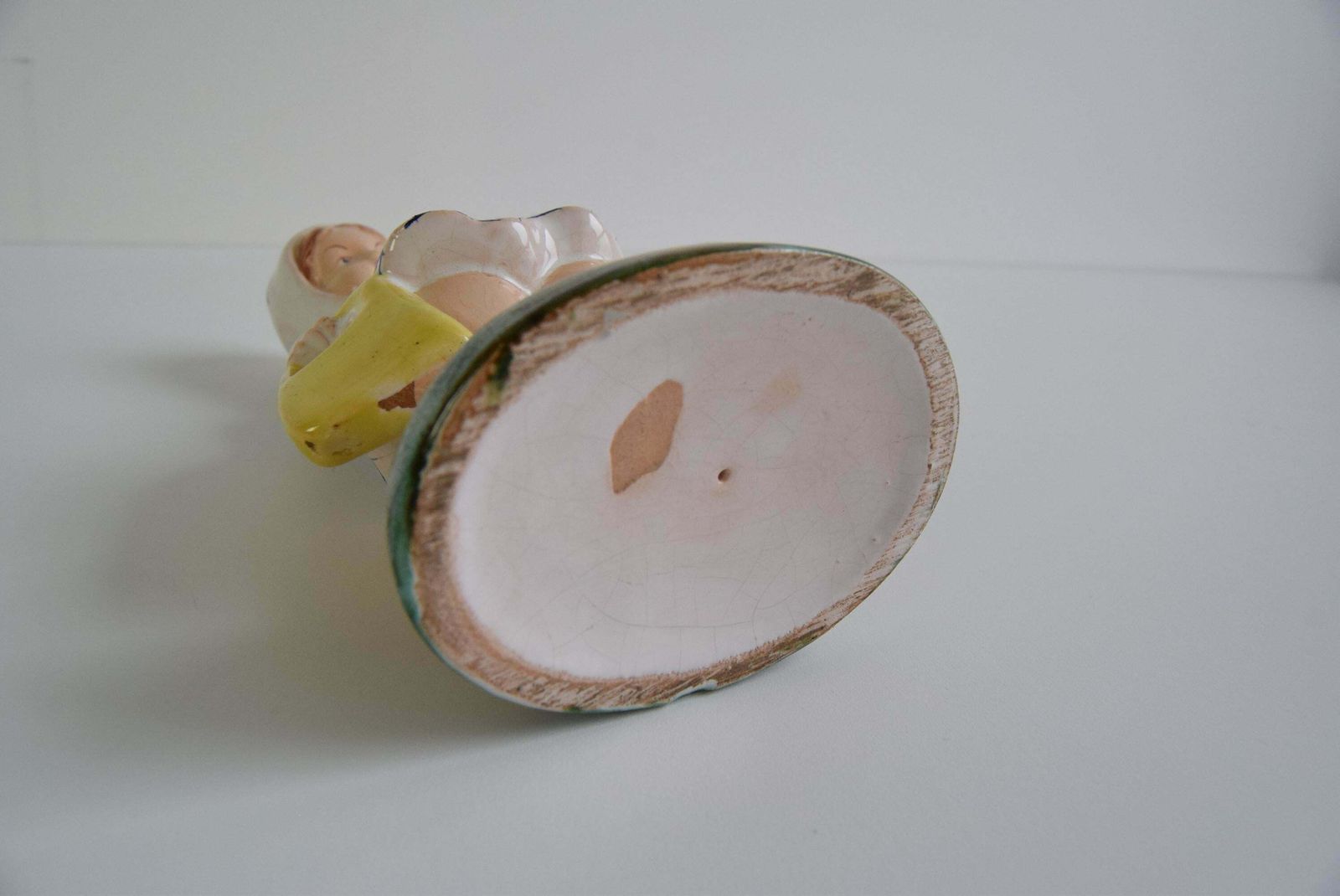 photo for sale Art Deco Ceramic Figurine Of A Girl With A Handbag, Circa 1940